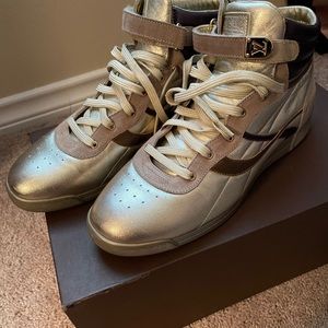 Louis Vuitton gold and purple high top sneakers.
